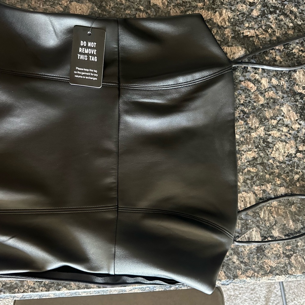 New with tags never worn leather express dress size small. Tags on